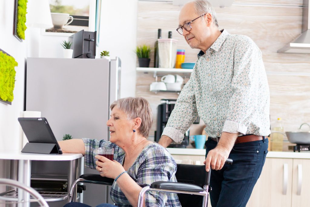 Senior patient uses a tablet to access speech therapy Senior patient uses a tablet to access speech therapy